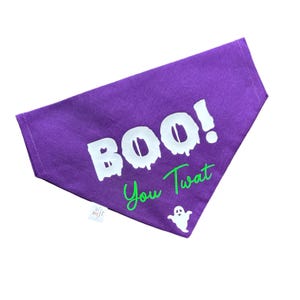 May include: Purple bandana with white text that says "BOO! You Twat" and a green ghost graphic.