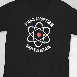 May include: Black t-shirt with a white atom graphic and the text "Science Doesn't Care What You Believe".
