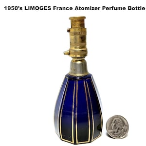May include: Vintage Limoges France atomizer perfume bottle. The cobalt blue glass bottle has gold accents and a brass atomizer top. The bottle is approximately 4 inches tall. A quarter is next to the bottle for size comparison.