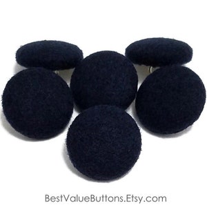 May include: Six navy blue fabric-covered buttons. The buttons are round and oval-shaped, with a textured surface. The buttons are arranged on a white background. The text "BestValueButtons.Etsy.com" is at the bottom.