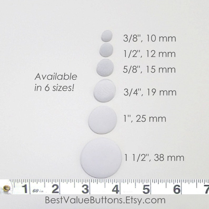 May include: White fabric-covered buttons in six sizes, ranging from 3/8 inch (10 mm) to 1 1/2 inches (38 mm). The image includes text that says "Available in 6 sizes!" and "BestValueButtons.Etsy.com".