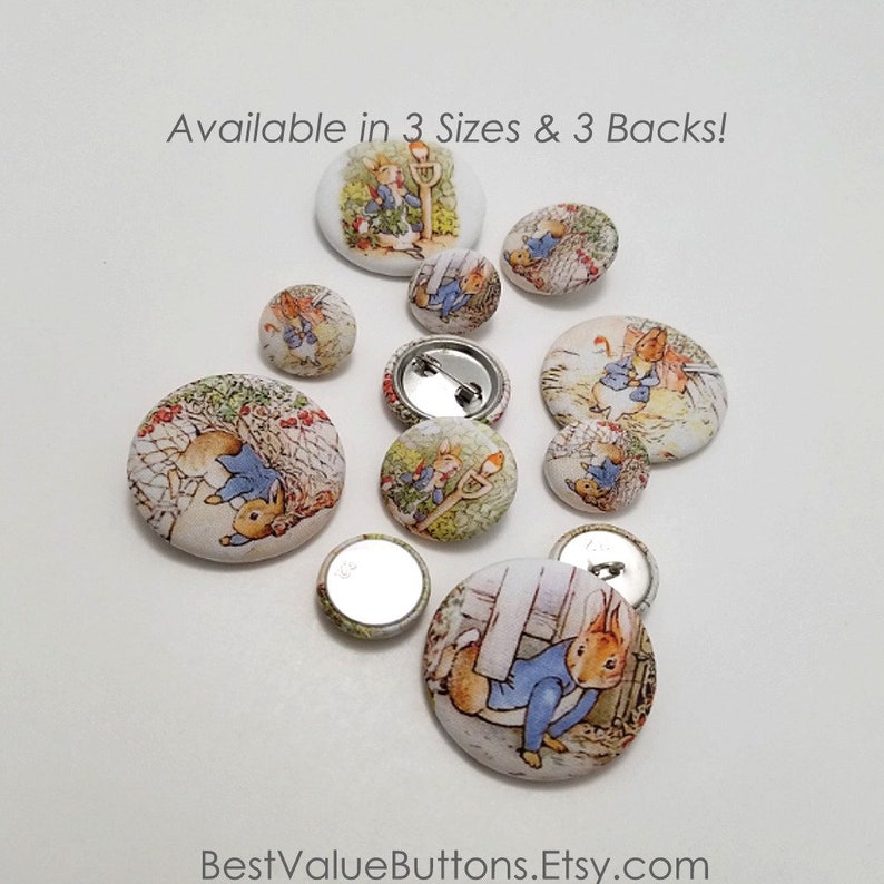 May include: A collection of Peter Rabbit fabric buttons in various sizes. The buttons feature different scenes from the book, including Peter Rabbit hiding in a garden and Peter Rabbit running away from Mr. McGregor. The buttons are available in three sizes and three back styles.
