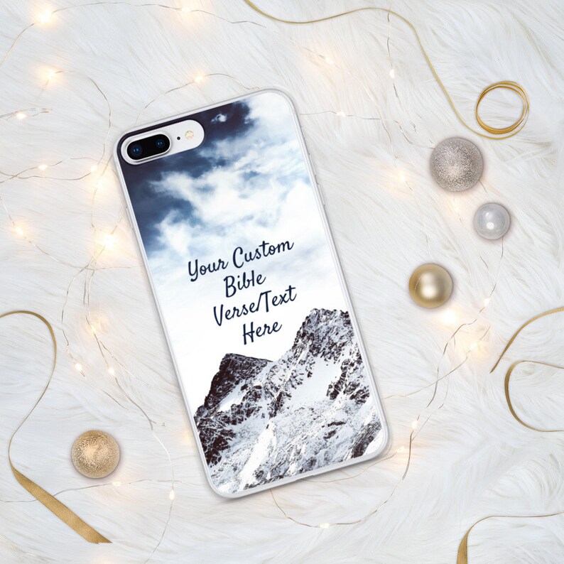 May include: A white phone case with a snowy mountain scene and a cloudy sky. The text "Your Custom Bible Verse/Text Here" is printed on the case.