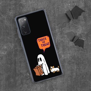 May include: Black phone case featuring a Halloween-themed design. The case displays a white ghost holding a brown paper bag, a small dog, and an orange speech bubble with the words "TRICK OR TREAT". Two black bat cutouts are in the background.