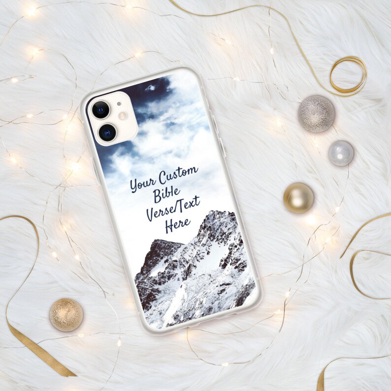 May include: A clear phone case with a mountain and cloudy sky design. The text "Your Custom Bible Verse/Text Here" is printed on the case.