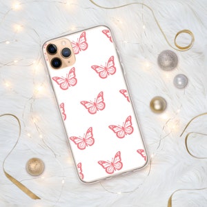 Puede incluir: Una funda de tel&eacute;fono transparente con fondo blanco y un patr&oacute;n de mariposas rosas.