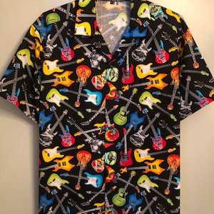 May include: Black button-down shirt with a vibrant pattern of colorful electric guitars. The guitars are in various colors, including red, yellow, blue, and green, set against a black background. The shirt has short sleeves and a classic collar.