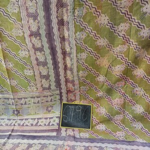 May include: A green and purple kantha quilt with a floral pattern. The quilt has a hand-stitched design and is made of cotton. A small chalkboard with the number 6796 is in the bottom right corner of the image.