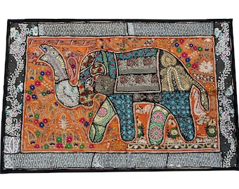 May include: A colorful patchwork elephant wall hanging with intricate embroidery and sequins. The elephant is depicted in a traditional Indian style with a bright orange background.