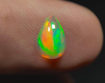 50/% discount on 0.60 ct Ethiopian welo opal.. Fire opal CABOCHON... 8x6 mm