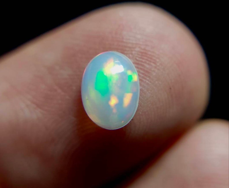50/% discount on 0.60 ct Ethiopian welo opal.. Fire opal CABOCHON... 8x6 mm