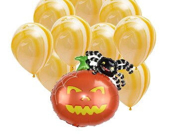 May include: A group of nine yellow and orange balloons with a black and white spider and a pumpkin shaped balloon. The pumpkin balloon has a jack-o-lantern face.