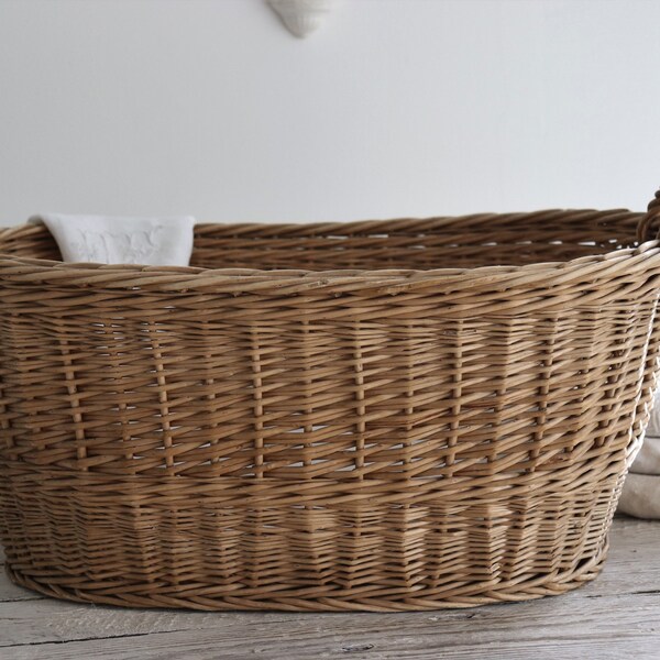 Large oval wicker laundry basket.