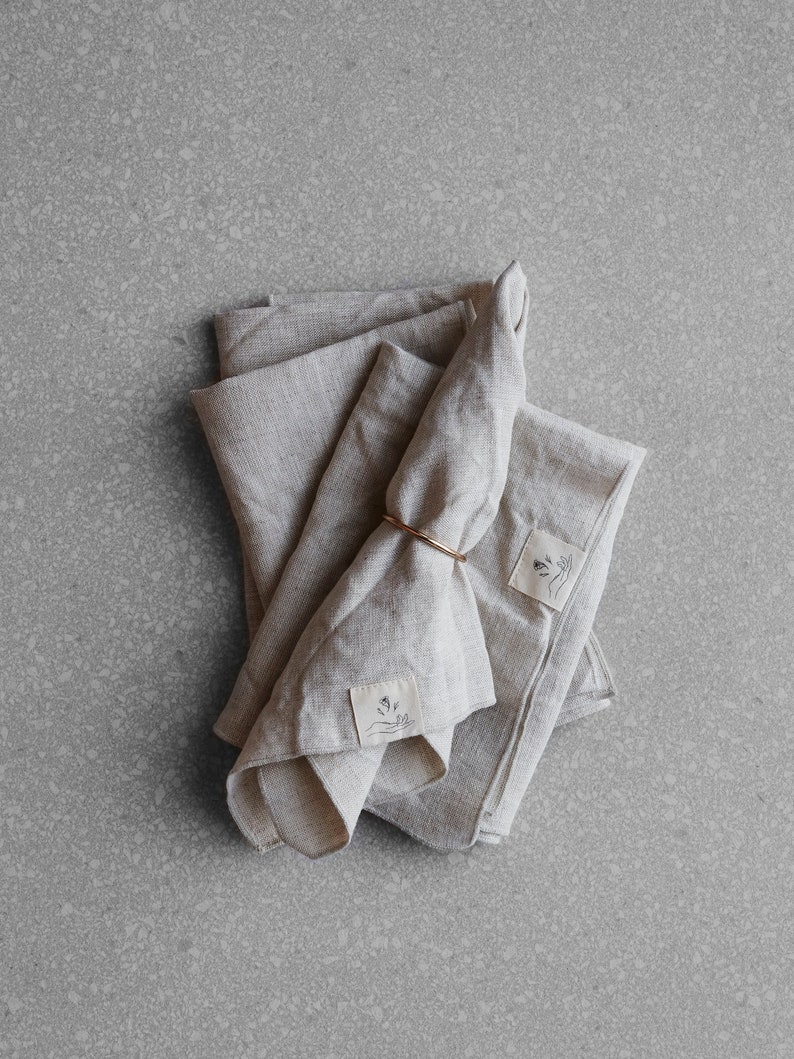 a set of four natural coloured linen napkins