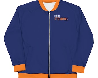 May include: A blue bomber jacket with orange trim and a zipper closure. The jacket has the text "LIGHTS LITTLE MACHINES" printed on the front.