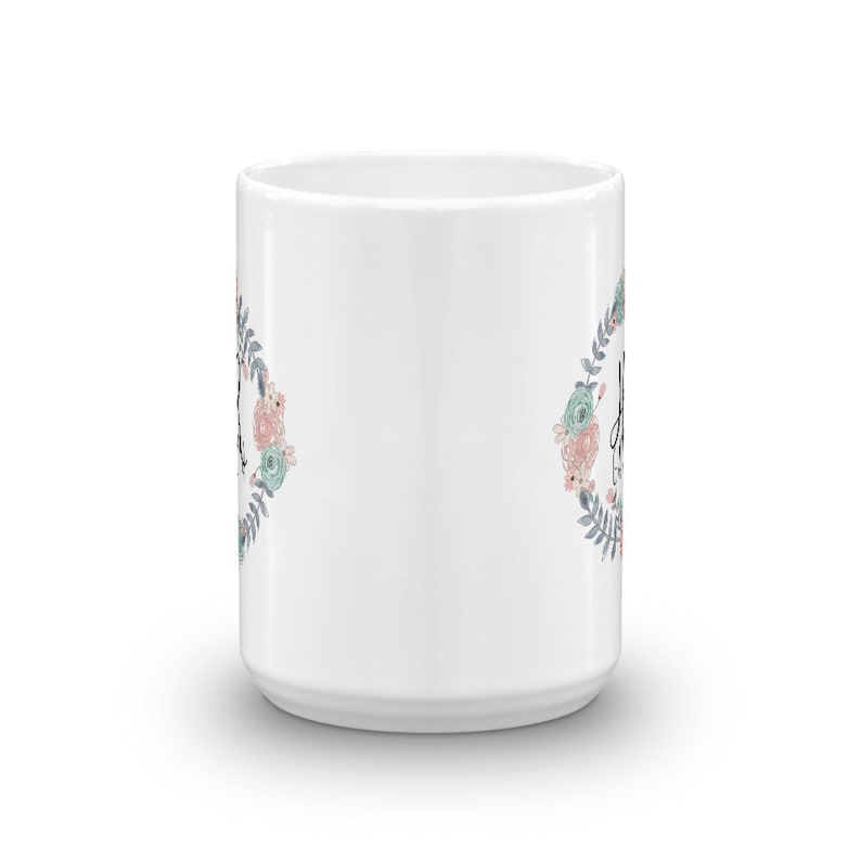 May include: White ceramic mug with a floral design and the text "Always be kind" in black lettering.