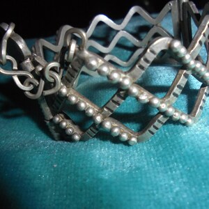 MOROCCAN JEWELRY, Saharan/Tuareg old silver zigzag granulated clasp bracelet with chain