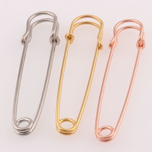 Metal brooch resembling a safety pin online
