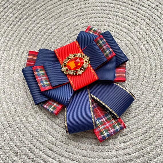 Red bow hotsell brooch