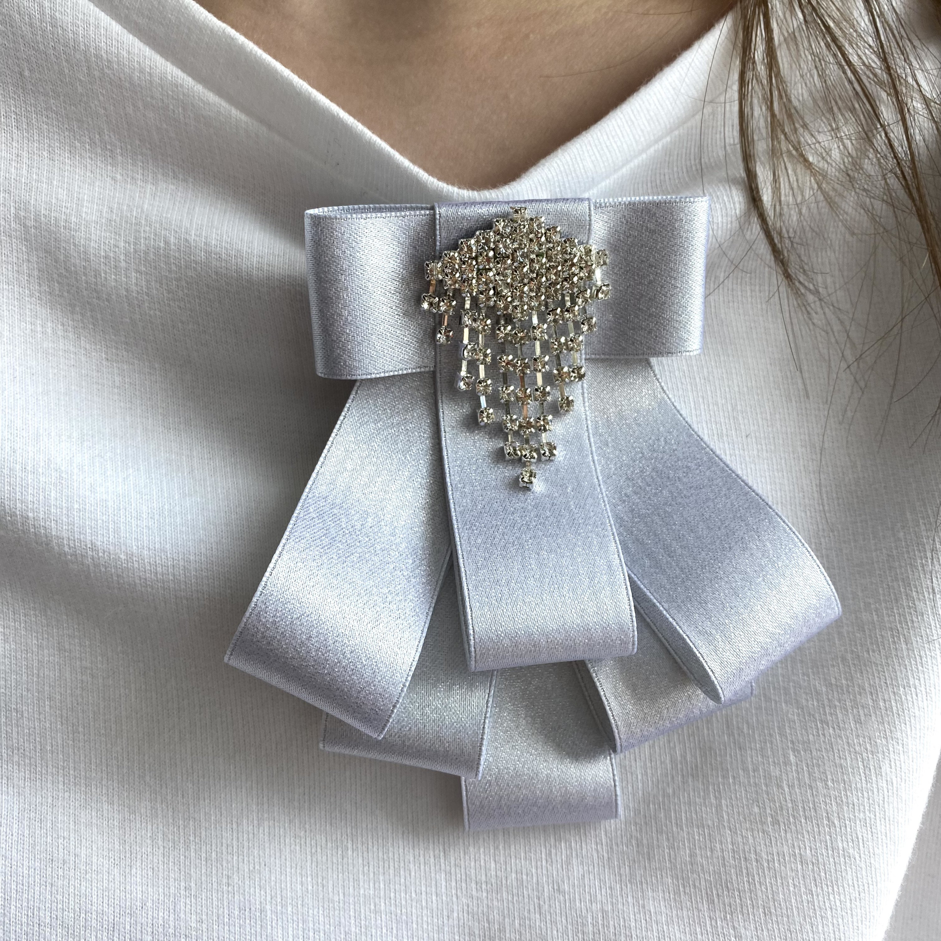 Brooch of White Satin Ribbon Bow With Rhinestone Center