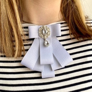 Brooch of white satin ribbon bow with rhinestone center. Gift for her. Women Handmade Brooch.