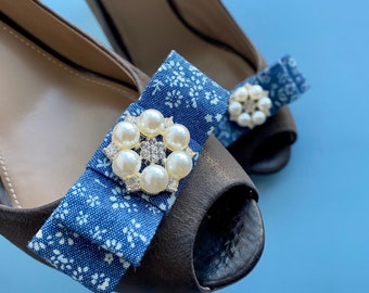 Denim bow shoe clips with pearls.