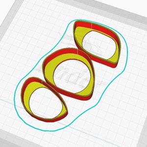 Pode incluir: Tr&ecirc;s an&eacute;is vermelhos e amarelos sobrepostos com um contorno turquesa. Os an&eacute;is est&atilde;o dispostos em uma pilha vertical.