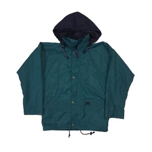 May include: A teal blue hooded jacket with a navy blue hood and a black "Helly Hansen" logo on the front.