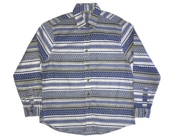 May include: A long-sleeved button-down shirt with a white background and blue and brown horizontal stripes. The stripes have a geometric pattern.