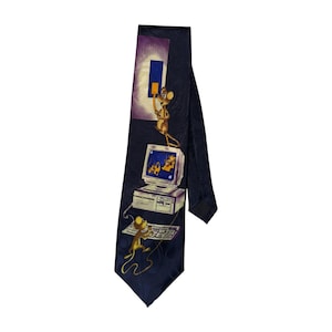 May include: A dark blue silk tie featuring a computer, keyboard, and three mice. The mice are cartoon characters interacting with the computer. The tie has a purple and white design.