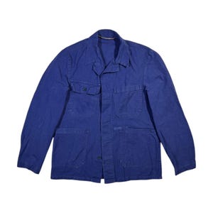 May include: A blue work jacket with multiple pockets and a button closure.