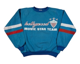 vintage des années 80 Hollywood Movie Star Team Sweatshirt authentique USA Sportswear bleu ras du cou M
