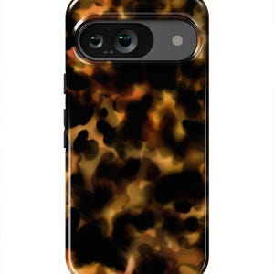 May include: A black phone case with a tortoiseshell pattern. The case has a raised camera bump with two lenses.