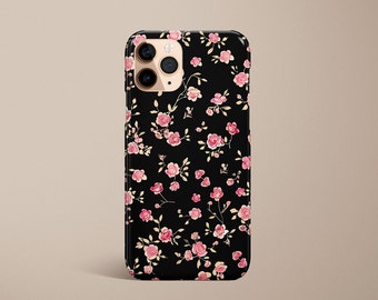 Op de afbeelding: Zwarte telefoonhoes met een roze en wit bloemenpatroon.