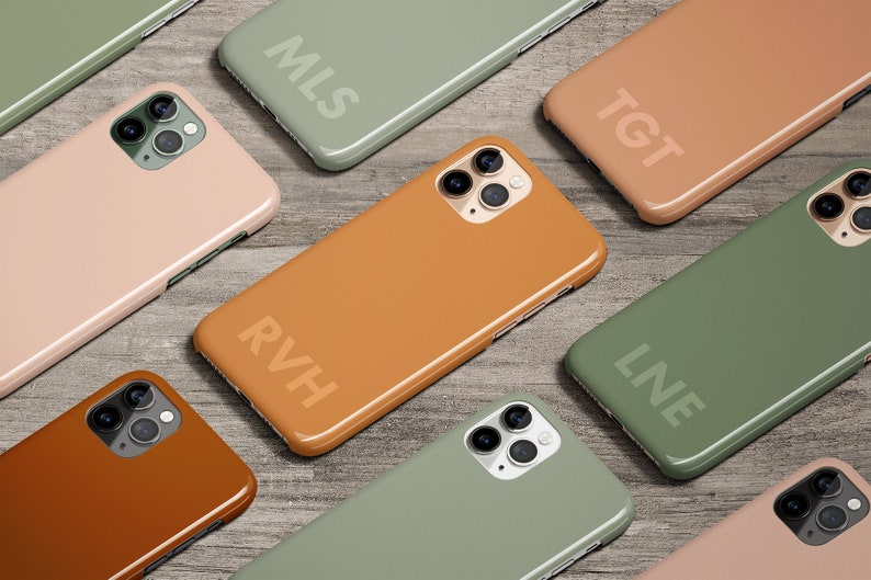 May include: Nine different colored phone cases with initials on each. The cases are in shades of green, brown, and pink.