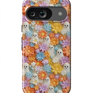 May include: A phone case with a colorful floral pattern and white ghosts. The flowers are in shades of orange, yellow, pink, blue, and white. The ghosts are scattered throughout the design.