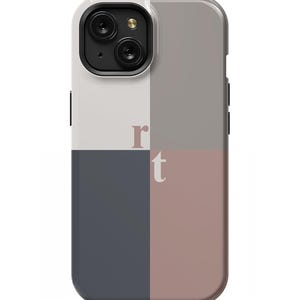 May include: A phone case with a geometric design featuring a white, gray, blue, and pink color scheme. The case has a cutout for the camera lens and the letters "r" and "t" are printed on the case.
