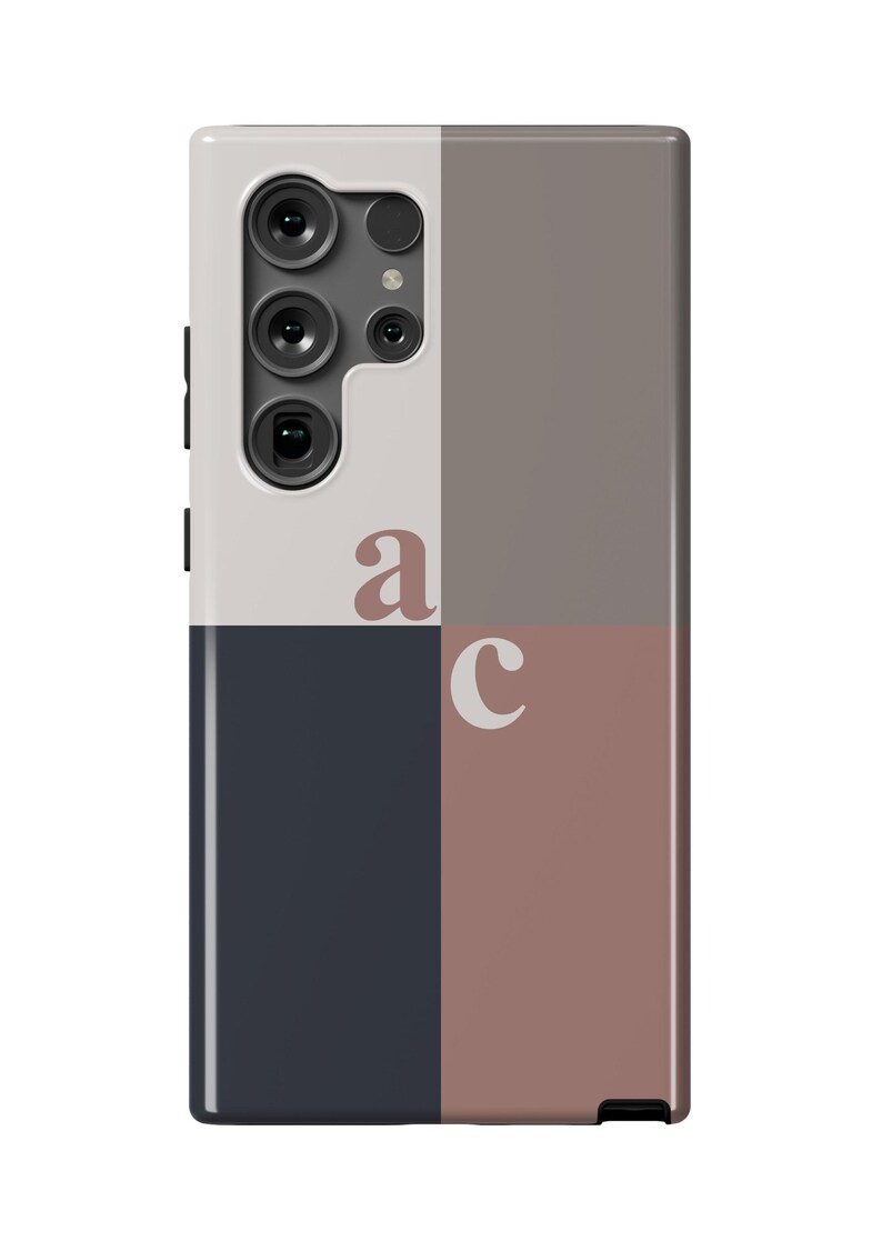 May include: A phone case with a geometric design featuring a white, gray, dark blue, and pink color scheme. The case has a cutout for the camera lens and the letters "a" and "c" are printed on the case.