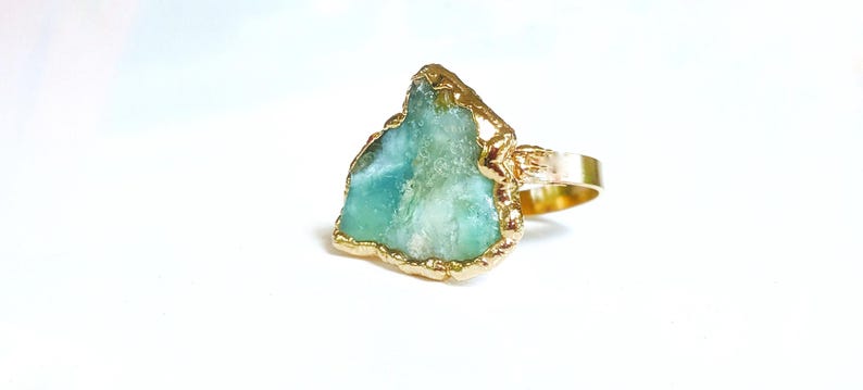 A large raw Peruvian Opal ring set in 18k Gold