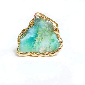 A large raw Peruvian Opal ring set in 18k Gold