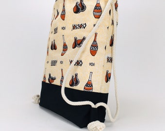 Brown drawstring backpack with African inspired Cotton Canvas fabric