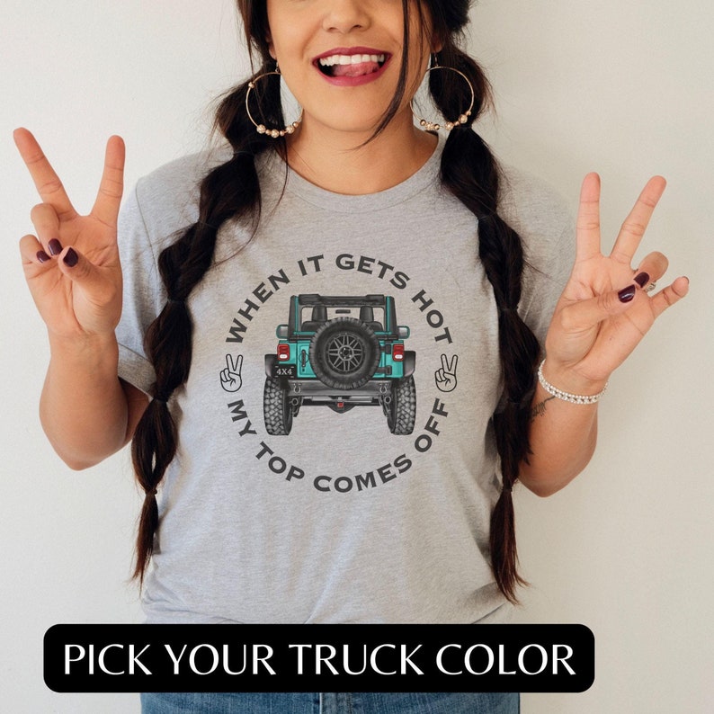 May include: Gray t-shirt with a graphic of a teal Jeep with the text "When it gets hot my top comes off".