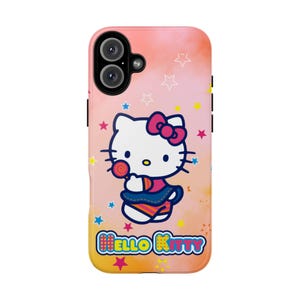 May include: A phone case with a Hello Kitty design, holding a lollipop, set against a pink and orange gradient background with star accents. The case has a black camera module and the words "Hello Kitty".