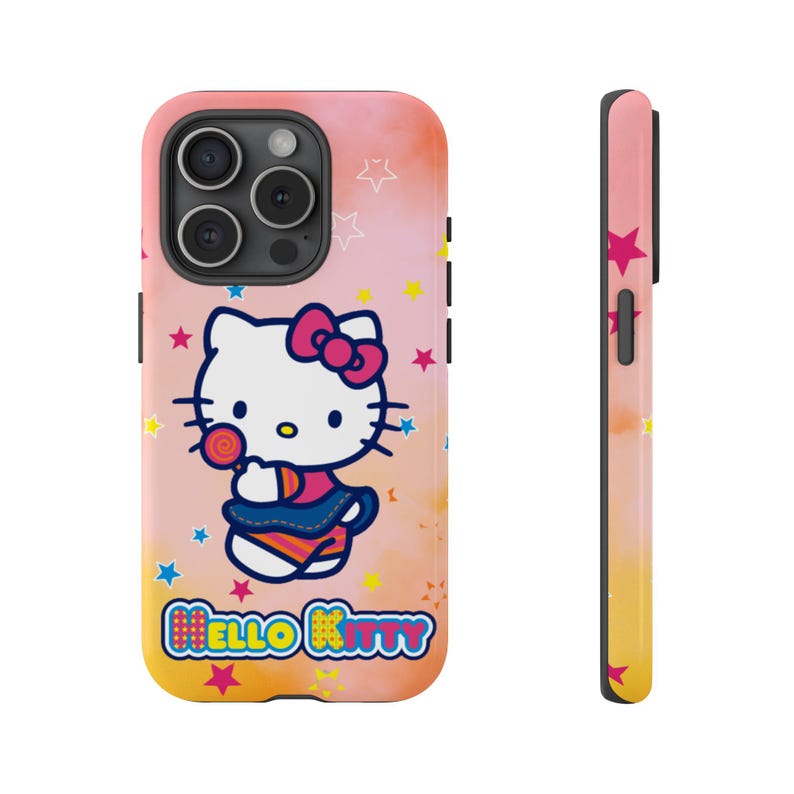 May include: A phone case with a Hello Kitty design, holding a lollipop, set against a pink, orange, and yellow gradient background with star accents. The case has a side view with a matching star pattern. The words "Hello Kitty" are displayed.
