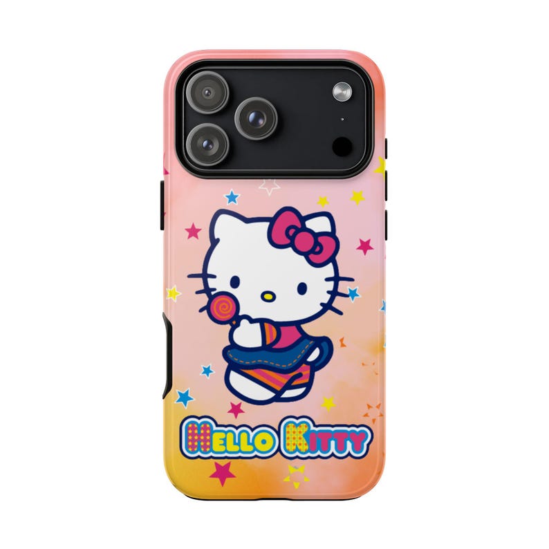 May include: A phone case with a Hello Kitty design, holding a lollipop, set against a pink, orange, and yellow gradient. The case has a black camera module and the words "Hello Kitty" are displayed at the bottom.