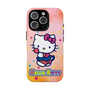 May include: A phone case featuring Hello Kitty with a pink bow, holding a lollipop. The case has a colourful background with stars and the words "Hello Kitty". The case is designed to fit a smartphone.