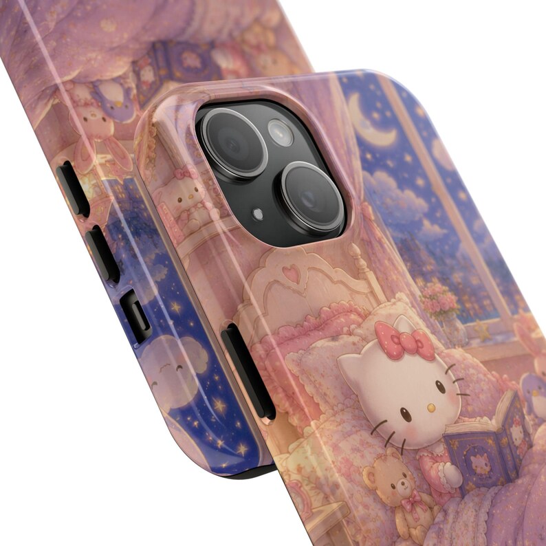 May include: A glossy phone case featuring a printed illustration of a white cat character with a pink bow reading a book in a bedroom. The scene includes a teddy bear, a crescent moon, and a starry night sky visible through a window in shades of pink.