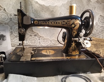 Vintage Franklin Sewing Machine with case quilting attachment, book and case with attachments