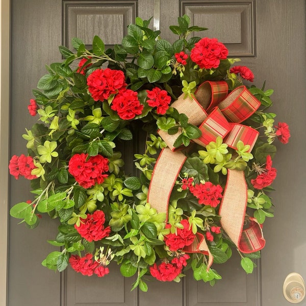 Full red geranium wreath with Milan leaf, and a D Stevens bow.