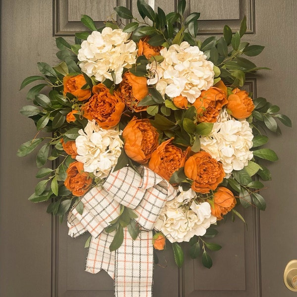 Lovely Fall wreath with a D Stevens faux wool bow, coffee peonies, and ivory hydrangeas, laurel leaf and Ruscus